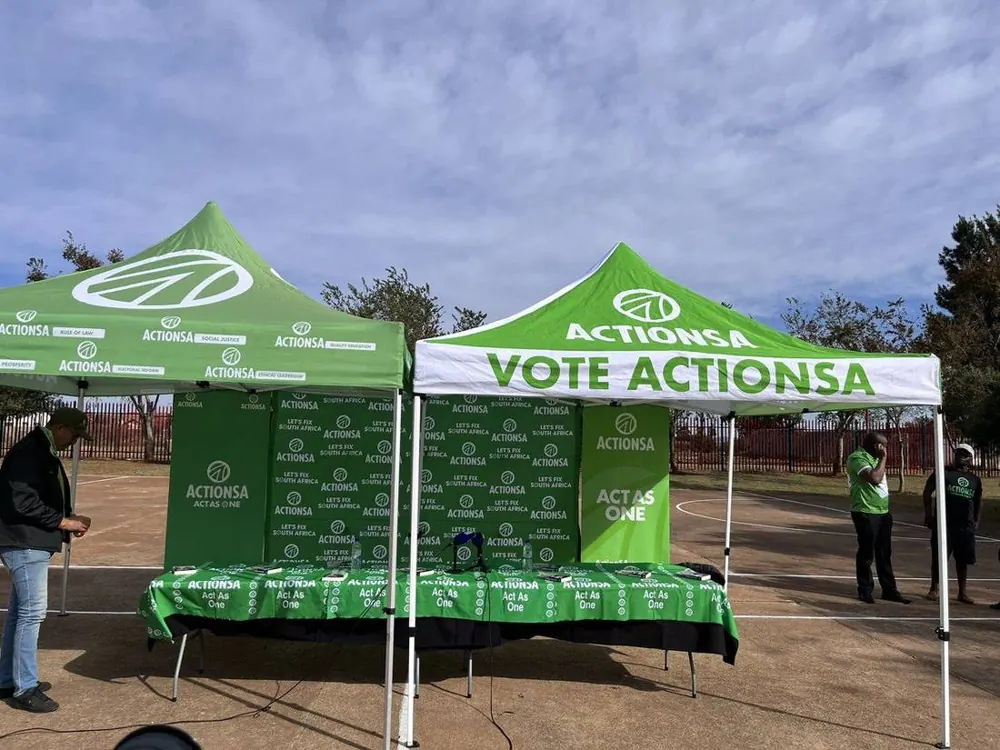 Branded gazebos, banner wall and printed table cloths supplied by AIM Signs & Branding for an ActionSA activation